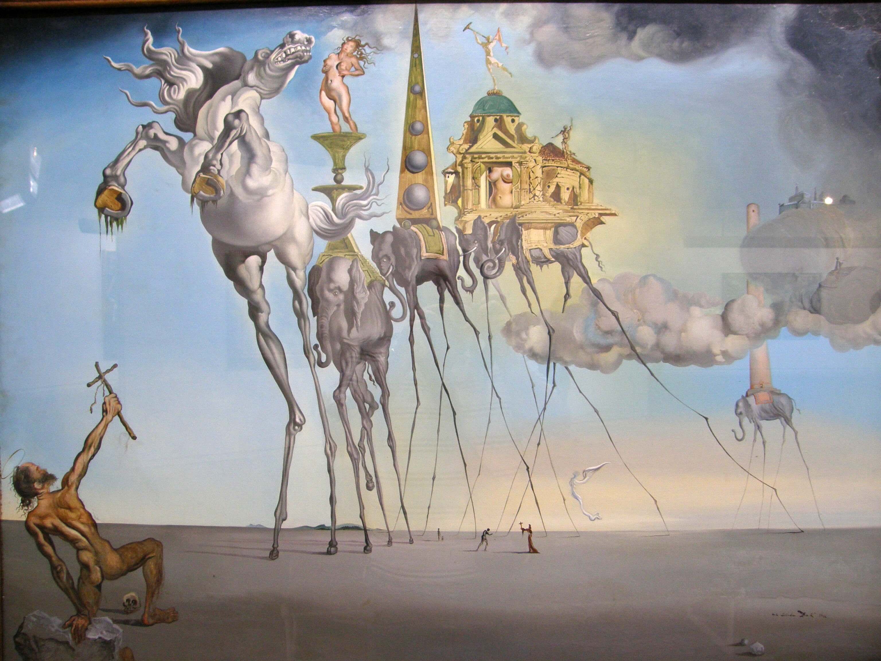 Le tableau est : La tentation de saint antoine par salvador dali qui représente aint Antoine, représenté nu comme un mendiant agenouillé dans le désert brandissant la croix de Christ. Ainsi que des chevaux possédant de très longues jambes.